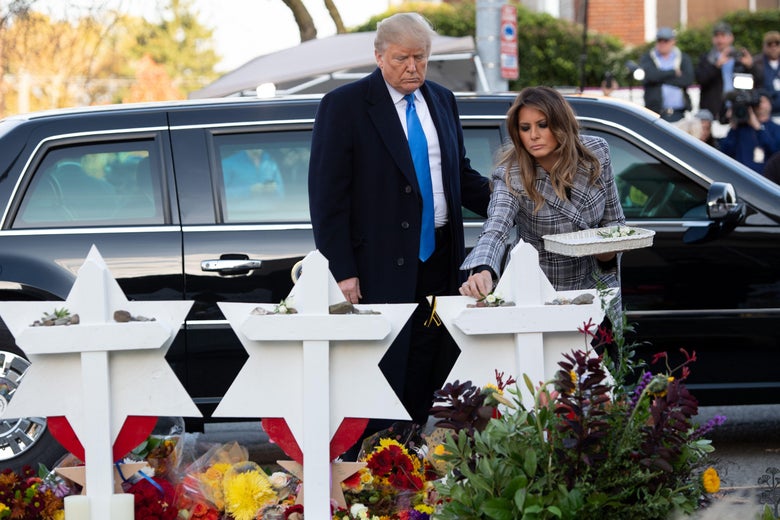 Donald Trump and his wife Melania along with Tree of Life's rabbi Jeffrey Myers, laying stones and flowers at memorials.